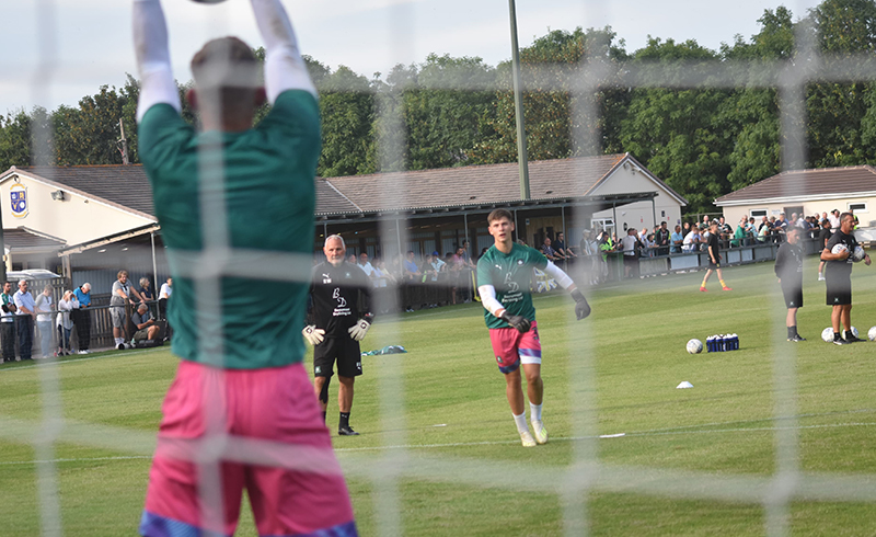 Michael Cooper and Alex Palmer warming up in the 2019/20 Plymouth Argyle training kit.